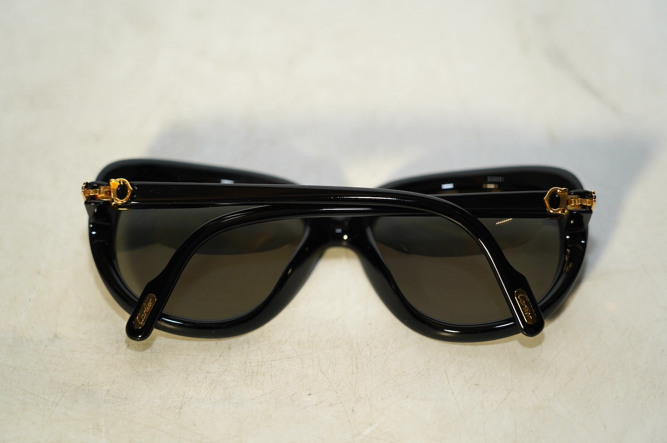 Two pairs of Must de Cartier sunglasses